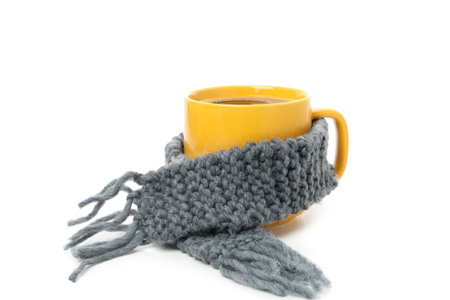 Cup of coffee with scarf isolated on white backgroundの写真素材