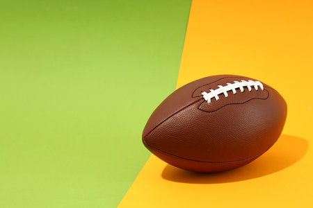 american football ball on two tone backgroundの写真素材