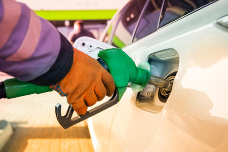 Refueling the car at a gas station fuel pump