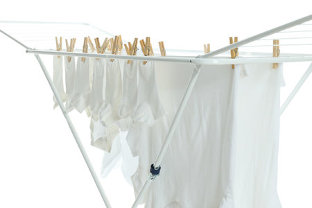 Drying rack with clothes, isolated on white backgroundの写真素材