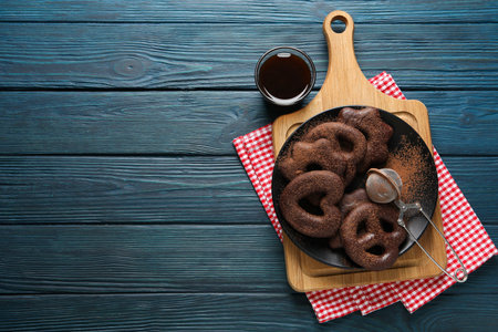 Concept of tasty bakery, gingerbread cookies in chocolate, space for textの写真素材