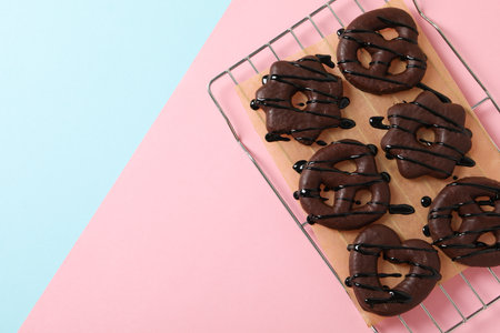 Concept of tasty bakery, gingerbread cookies in chocolate, space for textの写真素材