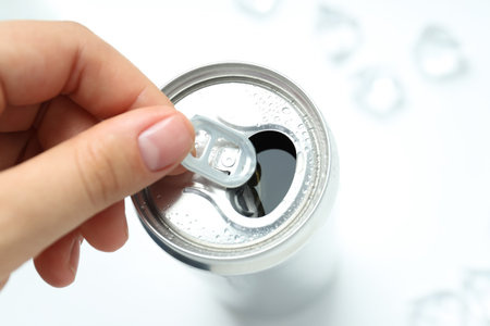 Female hand open can with drink, close upの写真素材