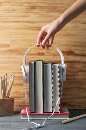 Concept of audiobook with books and headphonesの写真素材