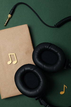 Concept of audiobook with book and headphones, top viewの写真素材