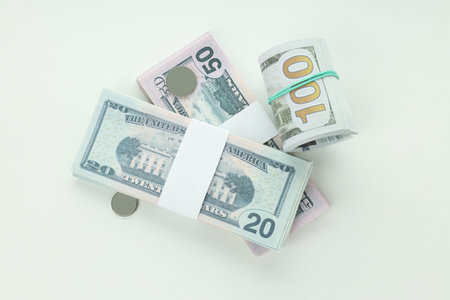 Concept of financials, dollars and coins isolated on white backgroundの写真素材