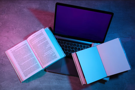 Concept of books vs technology, old search for information vs modern search for informationの写真素材