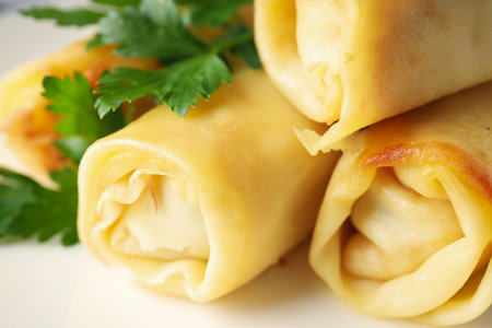 Concept of tasty food, thin pancakes with filling