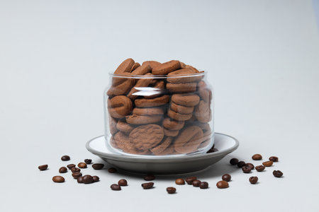 Concept of tasty snack for hot drink - cookies in the shape of coffee seedsの写真素材