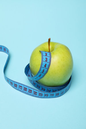 Diet and weight loss, healthy lifestyle, composition with measuring tapeの写真素材