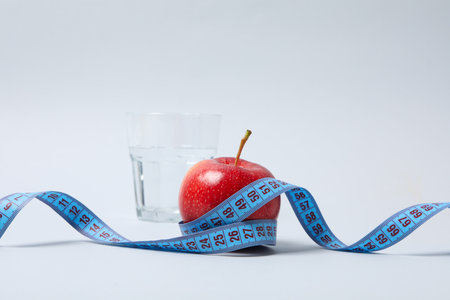 Diet and weight loss, healthy lifestyle, composition with measuring tapeの写真素材
