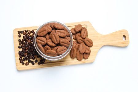 Concept of tasty snack for hot drink - cookies in the shape of coffee seeds