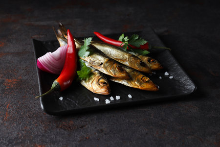 Concept of tasty food - delicious smoked fishの写真素材