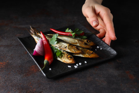 Concept of tasty food - delicious smoked fishの写真素材