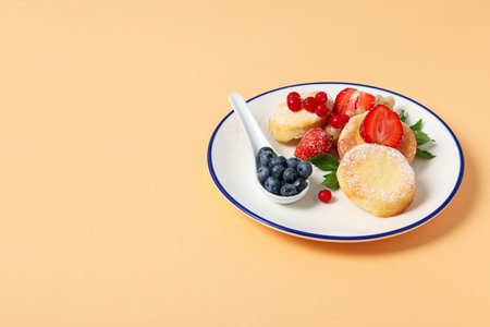 Concept of tasty sweet food, cheese pancakes, space for text