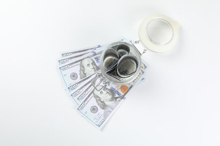 Jar with Dollar bills on white backgroundの写真素材