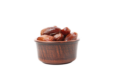 Concept of sweet and tasty food - dates, isolated on white backgroundの写真素材