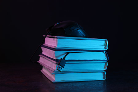 Concept of books vs technology, old search for information vs modern search for informationの写真素材