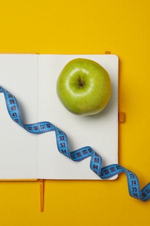 Diet and weight loss, healthy lifestyle, composition with measuring tapeの写真素材