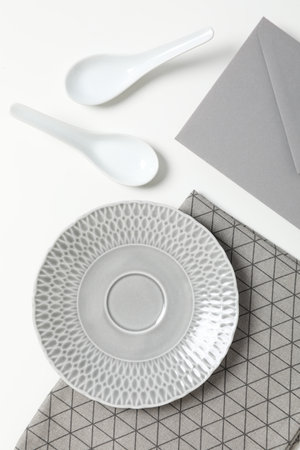 Minimal table setting with blank dish, top viewの写真素材