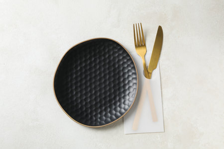 Minimal table setting with blank dish, top viewの写真素材