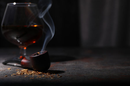 Concept of relaxing, smoking pipe, space for textの写真素材