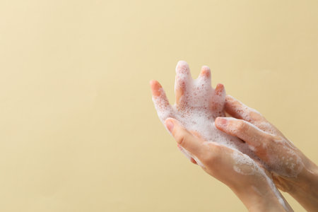Hands with foam, spa, beauty procedures and skin care conceptの写真素材