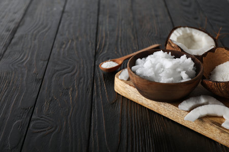Composition with coconut on wooden background, space for textの写真素材