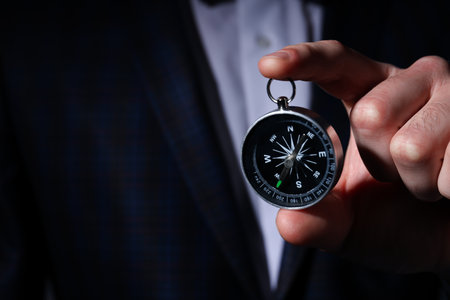 Business navigate concept with compass in businessman handの写真素材