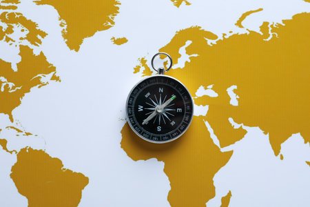 Traveling, adventure and vacation concept with compass