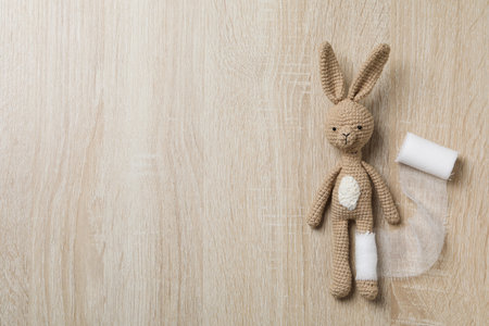 Concept of child injury with bunny with bandageの写真素材