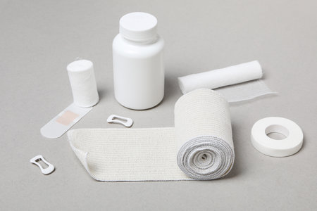 First aid kit supplies on gray backgroundの写真素材