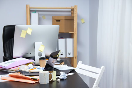 Messy office workplace, workplace and workspace conceptの写真素材