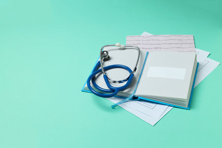 Medical literature - book and medical accessories on mint backgroundの写真素材