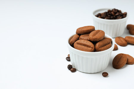 Concept of tasty snack for hot drink - cookies in the shape of coffee seedsの写真素材