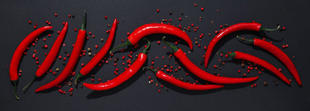 Concept of hot and spicy ingredients - red hot chili pepper