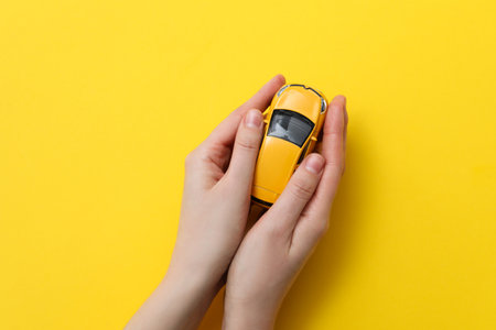Concept of car purchase and insurance with toy carの写真素材