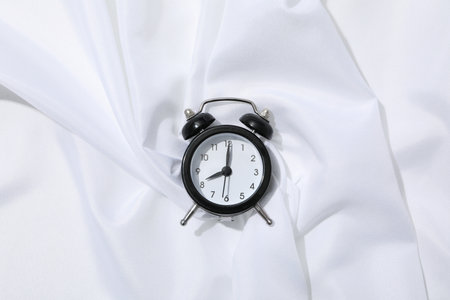 Concept of sleep and wake up with alarm clockの写真素材