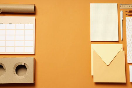 Mockup flat lay with freelancer office accessories on beige backgroundの写真素材