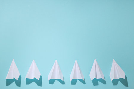 Business, startup and sponsorship concept with paper planes on blue backgroundの写真素材