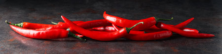 Concept of hot and spicy ingredients - red hot chili pepper