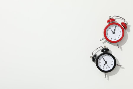 Concept of sleep and wake up with alarm clocksの写真素材