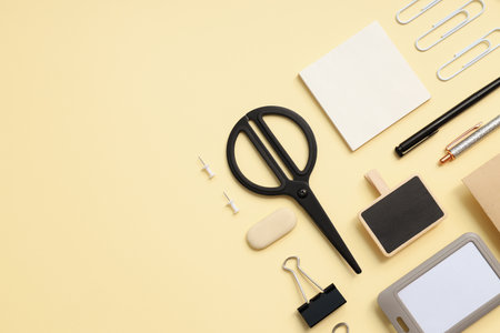 Mockup flat lay with different office accessories on beige backgroundの写真素材