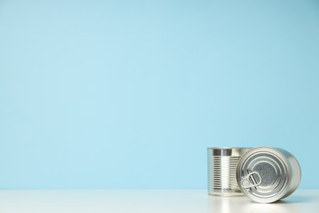 Canned food in blank metal jars, concept of canned food