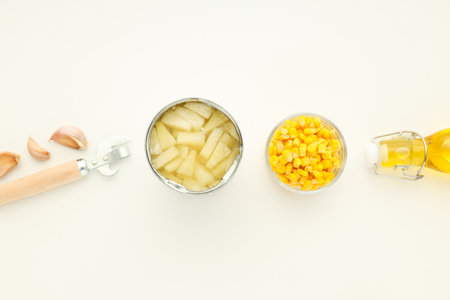 Ingredients for cooking salad with canned pineapple on white backgroundの写真素材