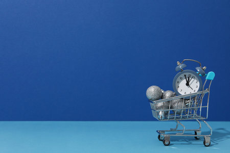 Concept of Christmas shopping time with alarm clockの写真素材