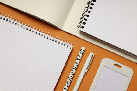 Mockup flat lay with different office accessories on brown background