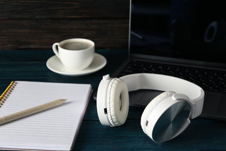 Concept of freelance, composition with hot drink and headphonesの写真素材