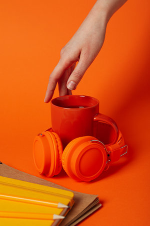 Concept of freelance, composition with hot drink and headphones