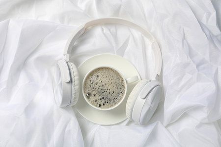 Concept of freelance, composition with hot drink and headphonesの写真素材